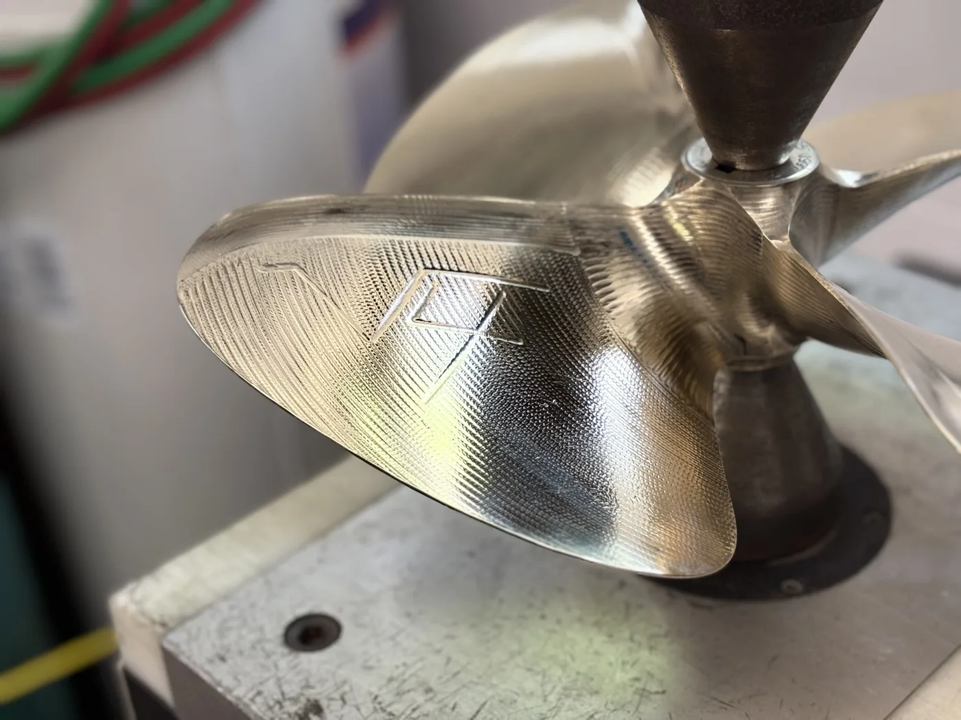 NiBrAl propeller after repair: polished blade with crisp logo