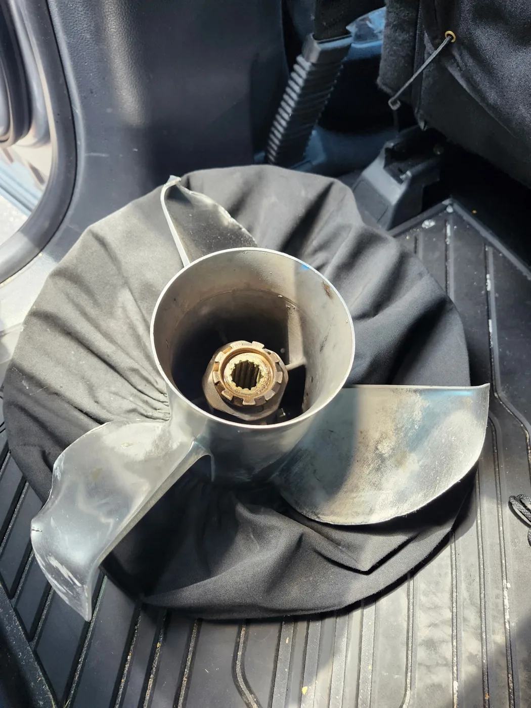 Stainless propeller before repair: dull, scratched blades